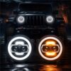 Jeep Wrangler JL headlights with DRL and turn signal on off-road trail at night