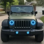 Buyer review photo of a Jeep Wrangler with blue halo headlights in a suburban driveway