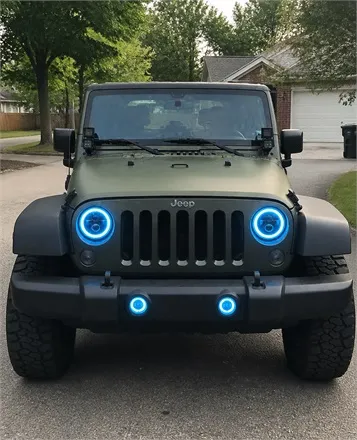 Buyer review photo of a Jeep Wrangler with blue halo headlights in a suburban driveway