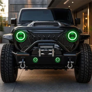 Front view of a black modified Wrangler with synchronized green halos glowing in the headlights and bumper fog lights