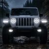 Jeep Wrangler JL headlights white halo DRL on wet muddy trail at night