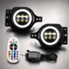 Pair of white halo fog lights beside an RGBW remote and wired controller on a brushed metal background