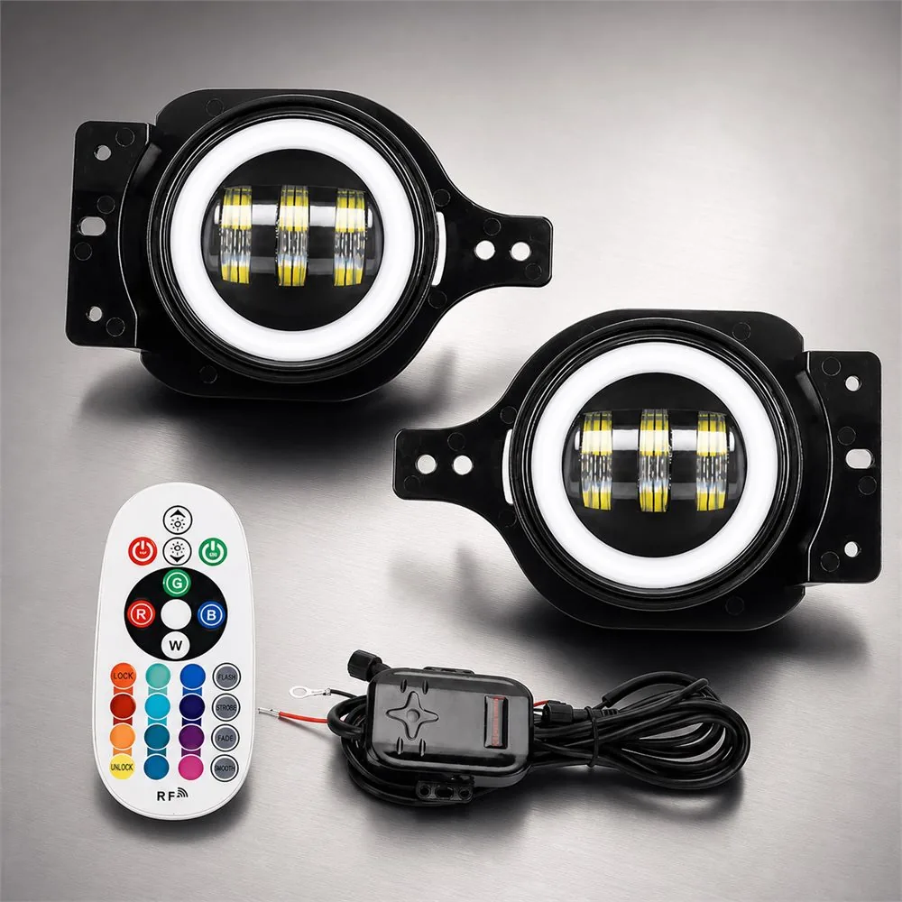 Pair of white halo fog lights beside an RGBW remote and wired controller on a brushed metal background