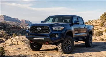 Toyota Tacoma with off-road tires, LED light bar and recovery equipment