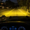 Amber road illumination from triple fog lamps on a 2021-2026 Ford Bronco during night driving
