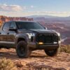 2022 Tundra fog lights showing amber sequential turn signal and white LED lighting on desert trail