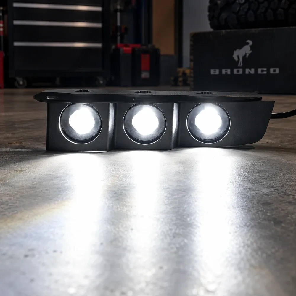 White beam output from a triple auxiliary light module for the Ford Bronco modular bumper