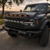 Angled view of Ford Bronco LED hood deflector with amber running lights
