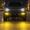 2021-2026 Ford Bronco modular bumper fog lights casting amber light for nighttime visibility