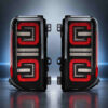 Smoked Bronco LED tail light assembly pair with dual-row red optical lighting design