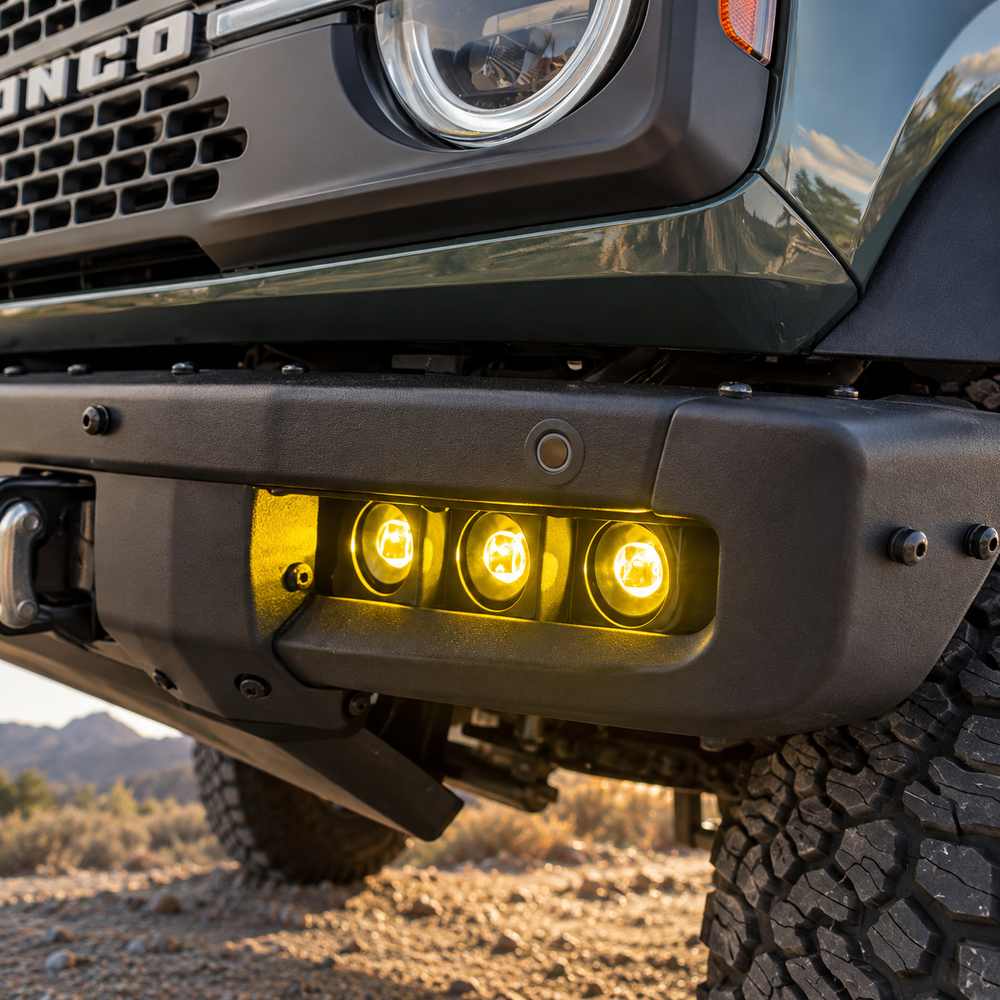 Close-up of triple amber LED pods fitted to a Ford Bronco steel modular front bumper