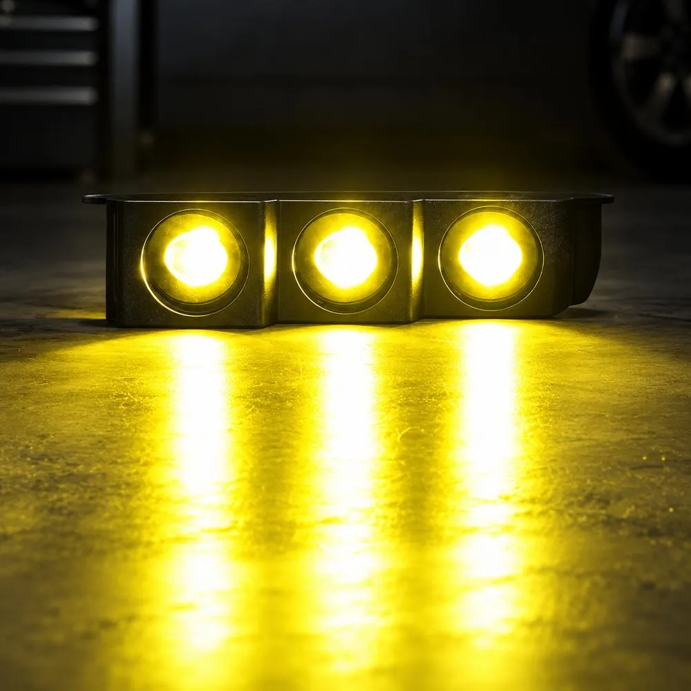 Yellow beam output from three fog lamps designed for a Ford Bronco modular front bumper