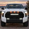 Front view of Toyota Tundra with three amber raptor lights above the grille