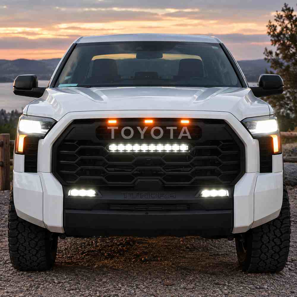 Front view of Toyota Tundra with three amber raptor lights above the grille