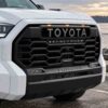Toyota Tundra TRD-style grille with three amber marker lights and center light bar